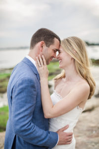 A bride and groom at their wedding at American Yacht Club. Photo by Kelly Kollar Photography.