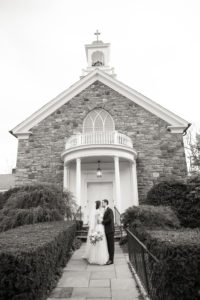A bride and groom after their wedding ceremony in Bedford, New York. Photo by Kelly Kollar Photography.