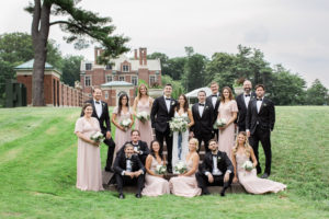 A wedding party in a vogue pose at The Mansion at Natirar in New Jersey. Photo by Kelly Kollar Photography.