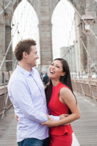 An engaged couple on the Brooklyn Bridge. Photo by Kelly Kollar Photography.