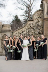 A wedding photo of a bride and her bridesmaids at Bethesda Terrace in Central Park. Photo by Kelly Kollar Photography.