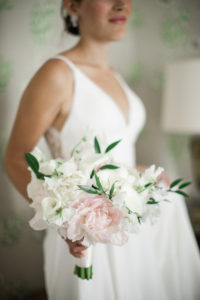 A bride holds her bouquet before her wedding at The Yale Club in Manhattan. Photo by Kelly Kollar Photography.