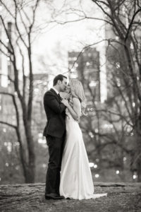A bride and groom on their wedding day at night in Central Park in Manhattan. Photo by Kelly Kollar Photography.