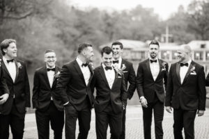A groom and his groomsmen in Central Park in Manhattan on his wedding day. Photo by Kelly Kollar Photography.