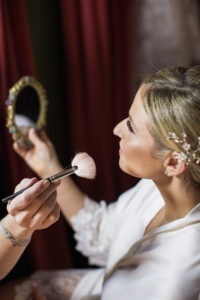 A bride has her makeup done for her wedding at Gramercy Park Hotel in Manhattan. Photo by Kelly Kollar Photography.