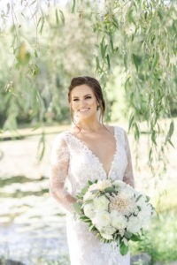 A bride on her wedding day at Jonathan Edwards Winery in Connecticut. Photo by Kelly Kollar Photography.