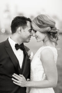 A bride and groom on their wedding day ay Liberty Warehouse in New Jersey. Photo by Kelly Kollar Photography.