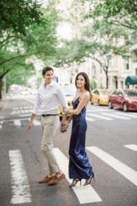An engaged couple crosses Fifth Avenue in Manhattan. Photo by Kelly Kollar Photography.