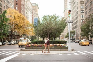 An engaged couple crossed Park Avenue in Manhattan. Photo by Kelly Kollar Photography.