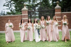 A bride and her bridesmaids at a wedding at The Mansion at Natirar in New Jersey. Photo by Kelly Kollar Photography.