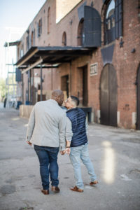 A same-sex couple's engagement photos in Redhook, Brooklyn at Liberty Warehouse. Photo by Kelly Kollar Photography.