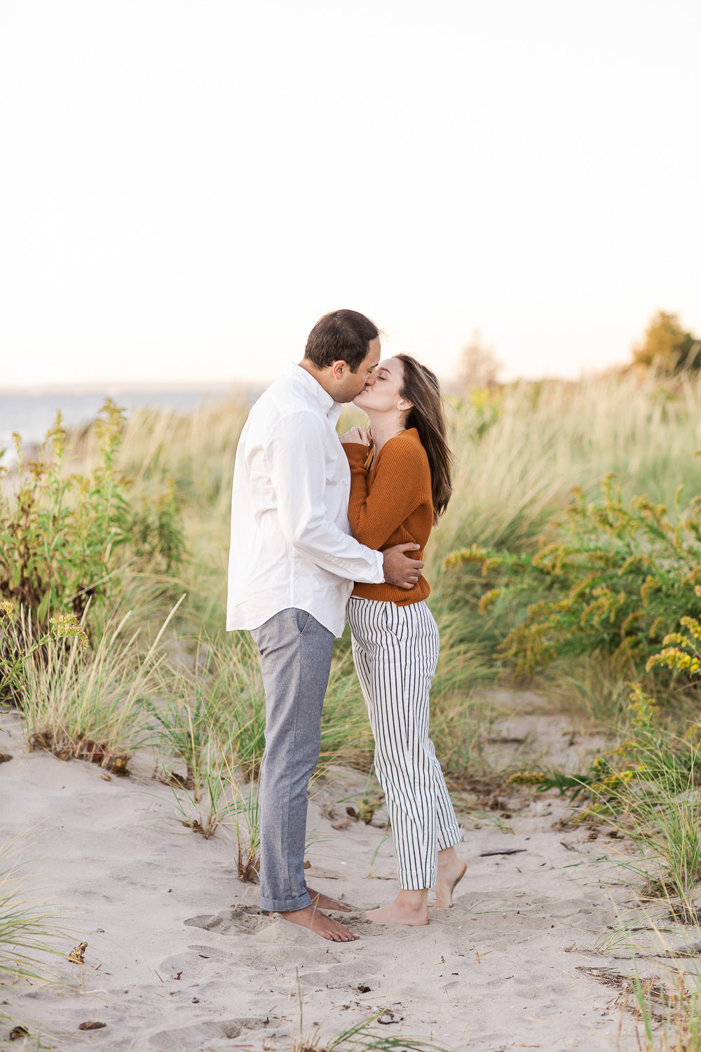 An engaged couple on the Sandy Hook National Seashore in New Jersey. Photo by Kelly Kollar Photography.