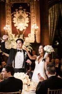 A bride and groom at their wedding reception at The University Club in Manhattan. Photo by Kelly Kollar Photography.